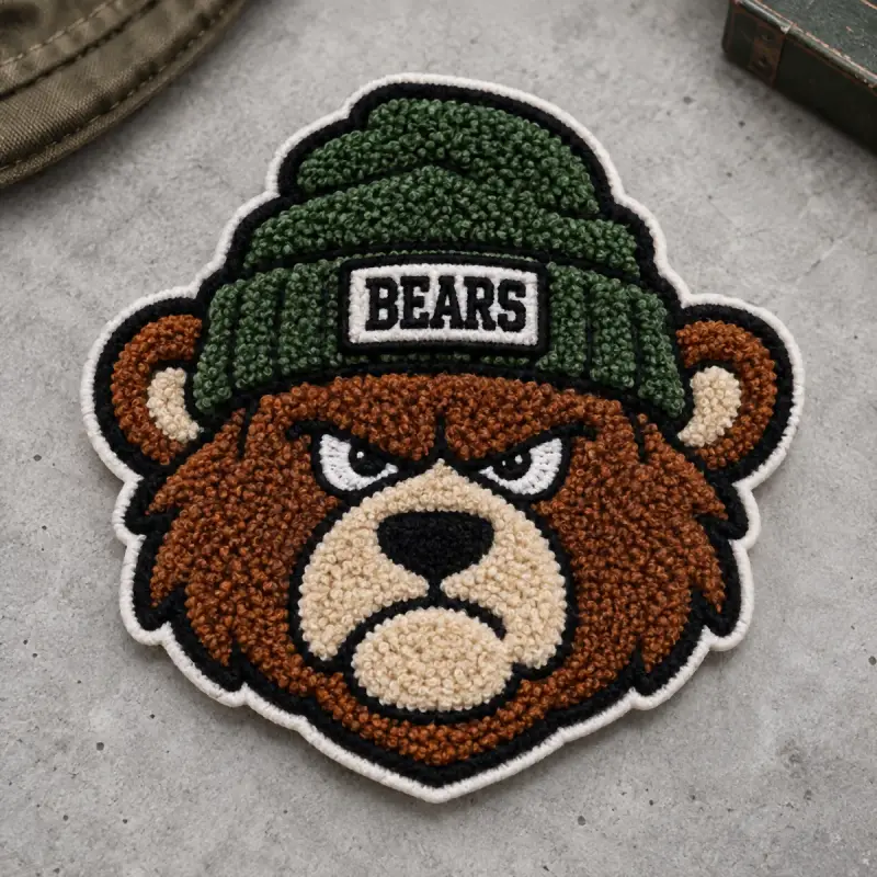 Chenille bear mascot patch wearing a green Bears beanie.