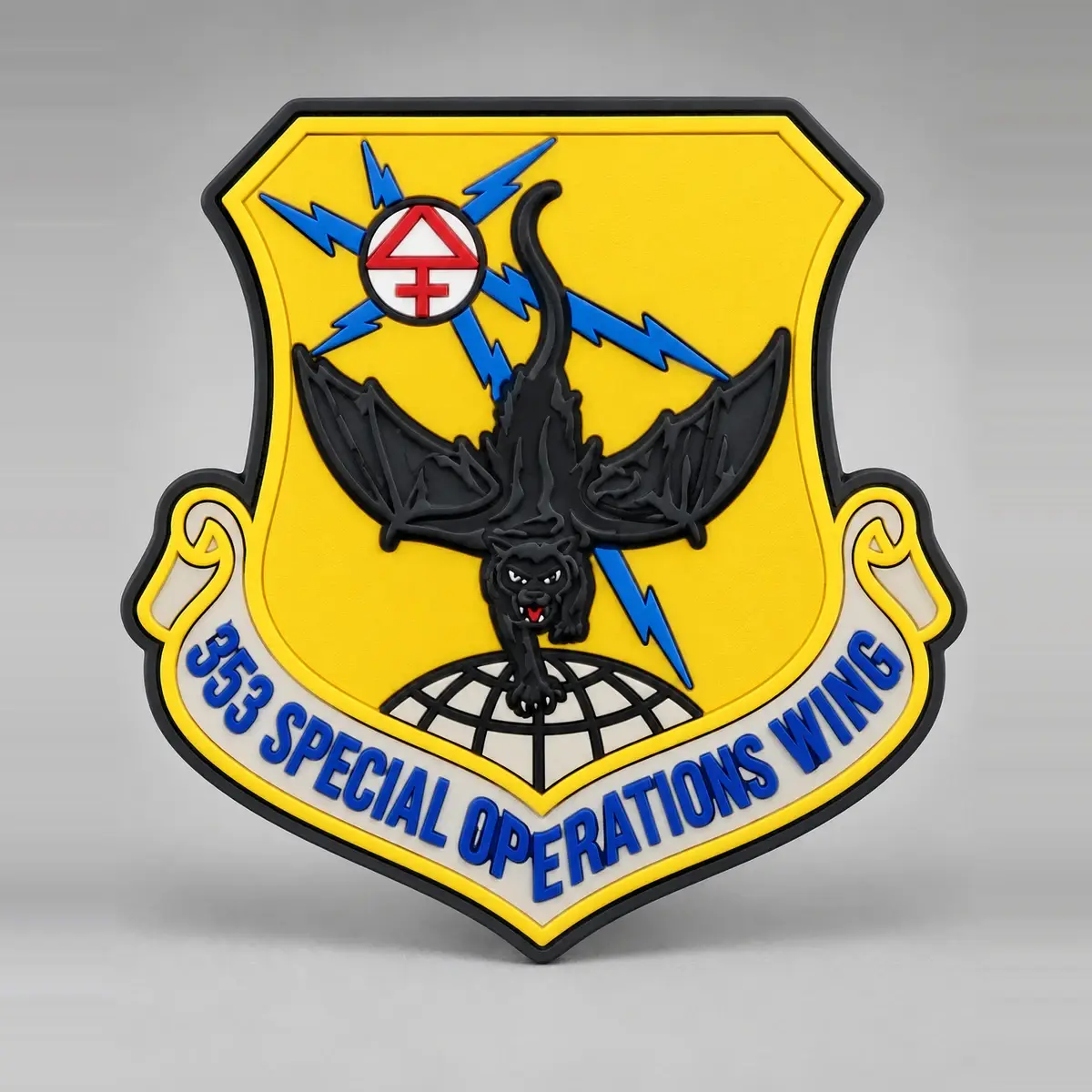 Molded 3D PVC 353 Special Operations Wing shield patch with a black cat over a globe on yellow.