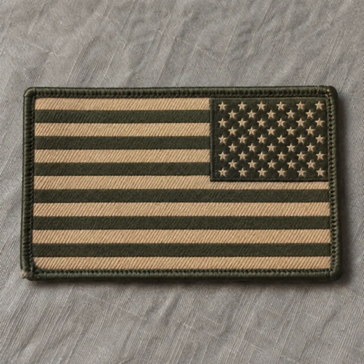 Subdued tan woven US flag patch.