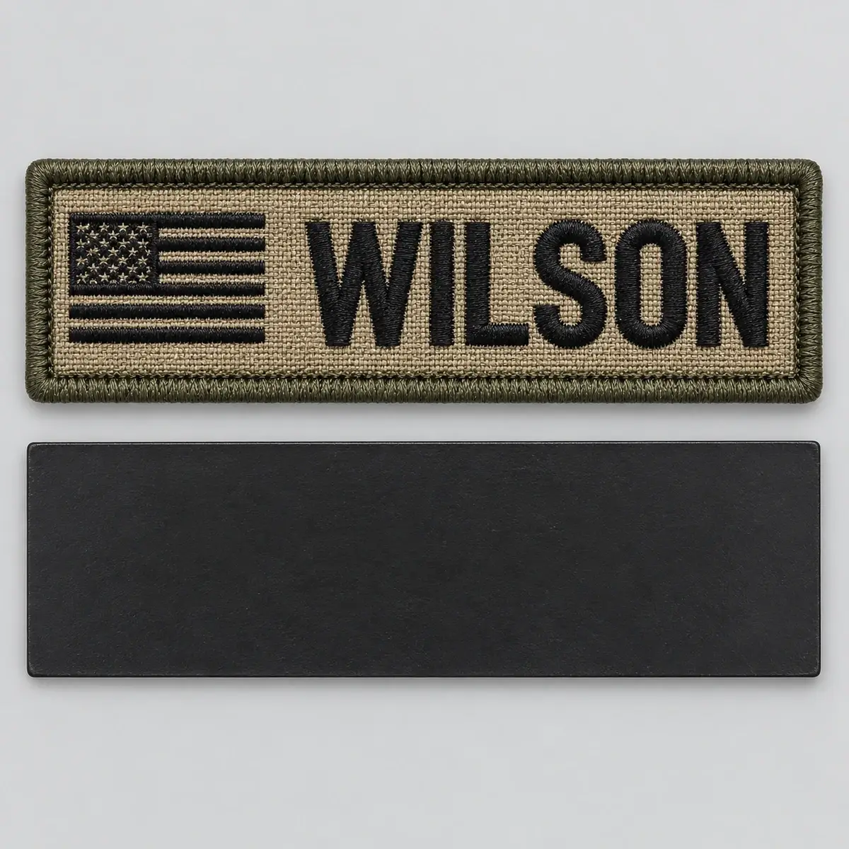 Coyote WILSON name patch with a flag above its black magnetic backing.