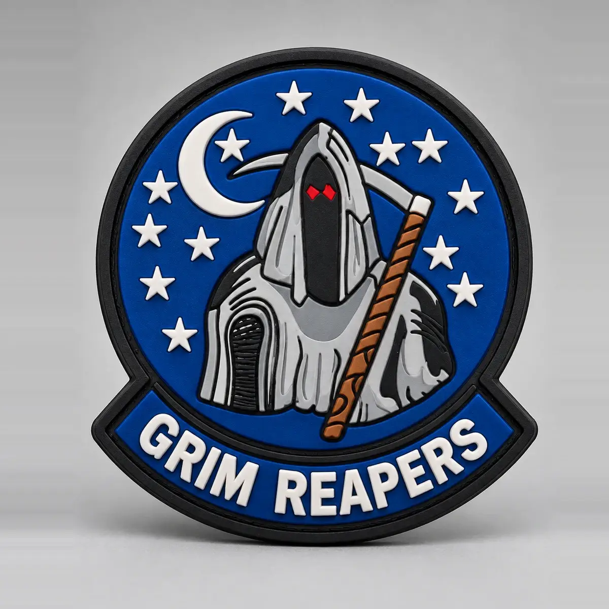 Molded PVC Grim Reapers patch with a hooded reaper under a crescent moon and white stars.