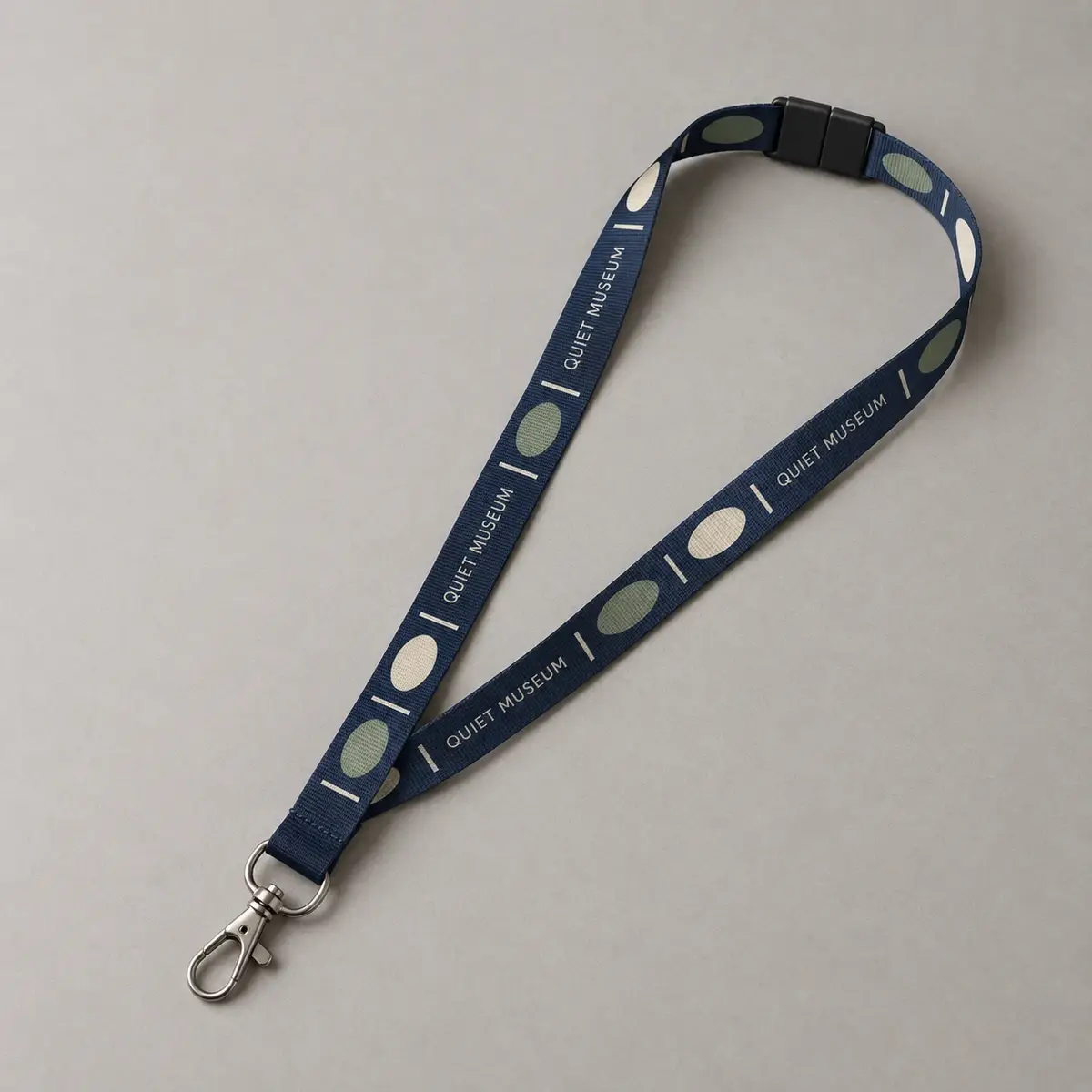 Navy Quiet Museum printed lanyard with a swivel hook.