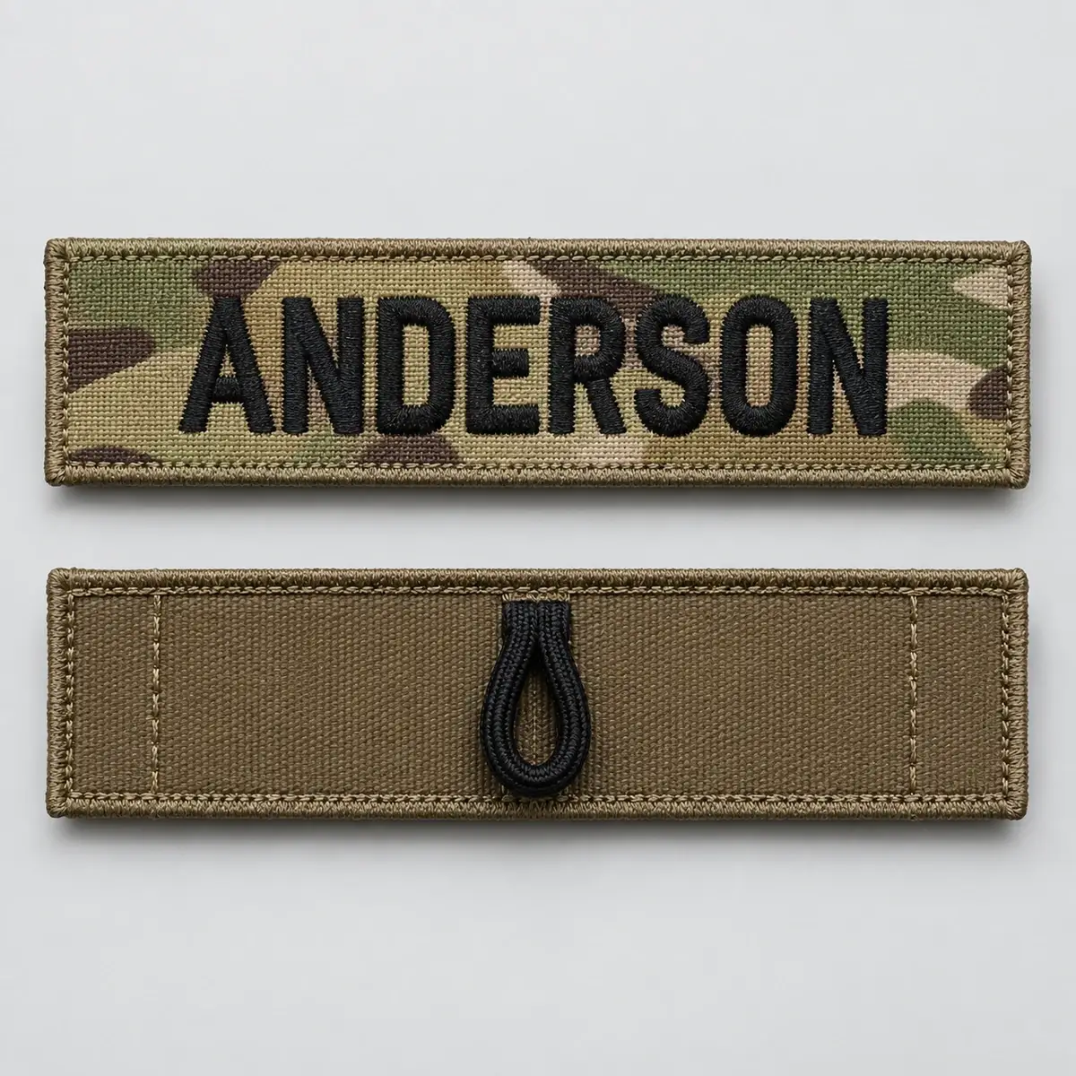 Multicam ANDERSON name tape above its back with a sewn cord loop.