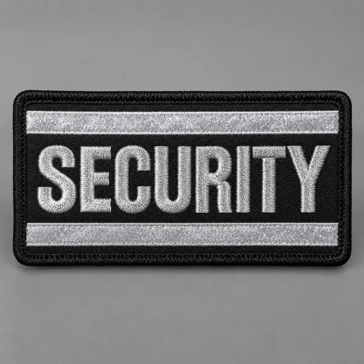 Rectangular reflective SECURITY patch with silver stripes on black.
