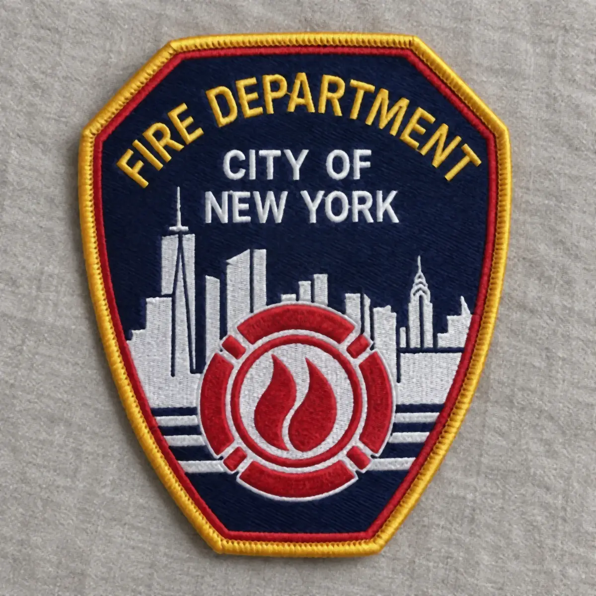 Embroidered Fire Department City of New York shoulder patch with a skyline and flame emblem.