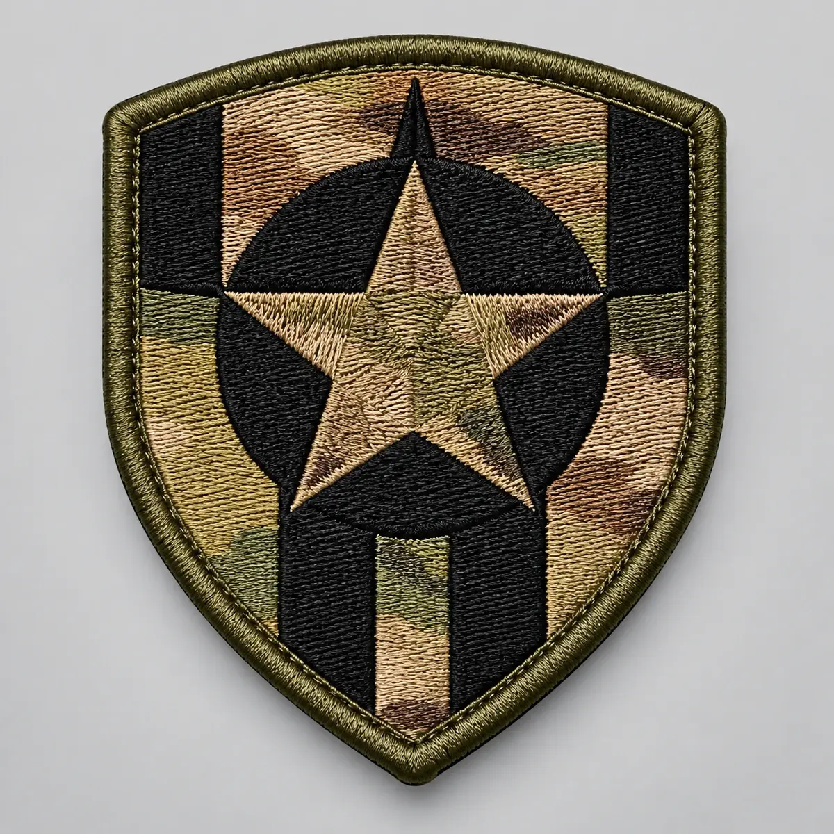 OCP camouflage shield patch with a star in a black circle.