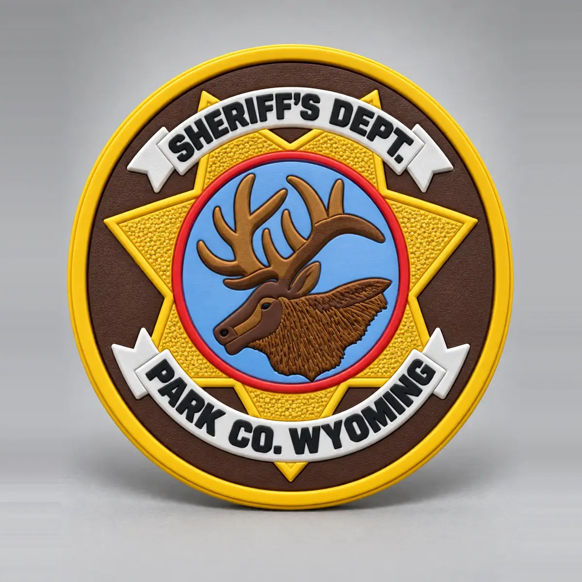 Molded PVC Sheriff's Dept. Park Co. Wyoming patch with an elk on a gold star.