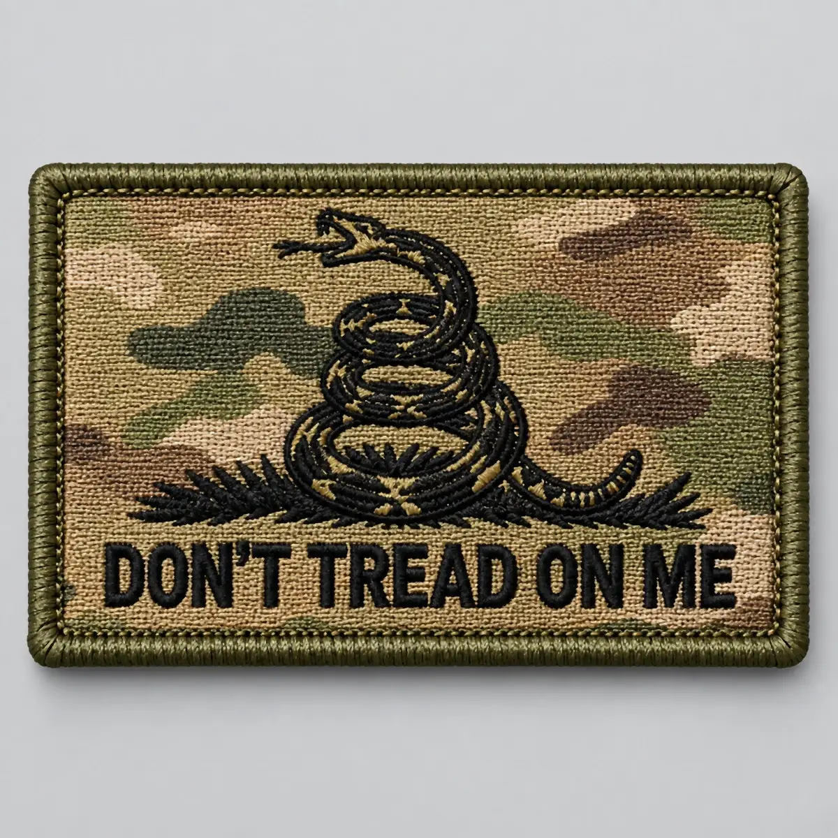 OCP camouflage Don't Tread On Me patch with a coiled rattlesnake.