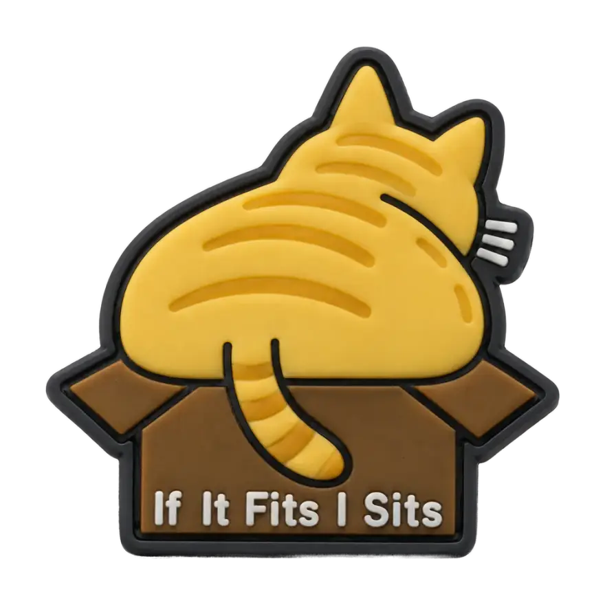 Silicone morale patch of a cat in a box reading If It Fits I Sits