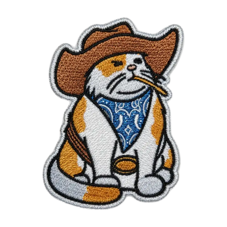 Embroidered calico cowboy cat patch with a stitched merrow border